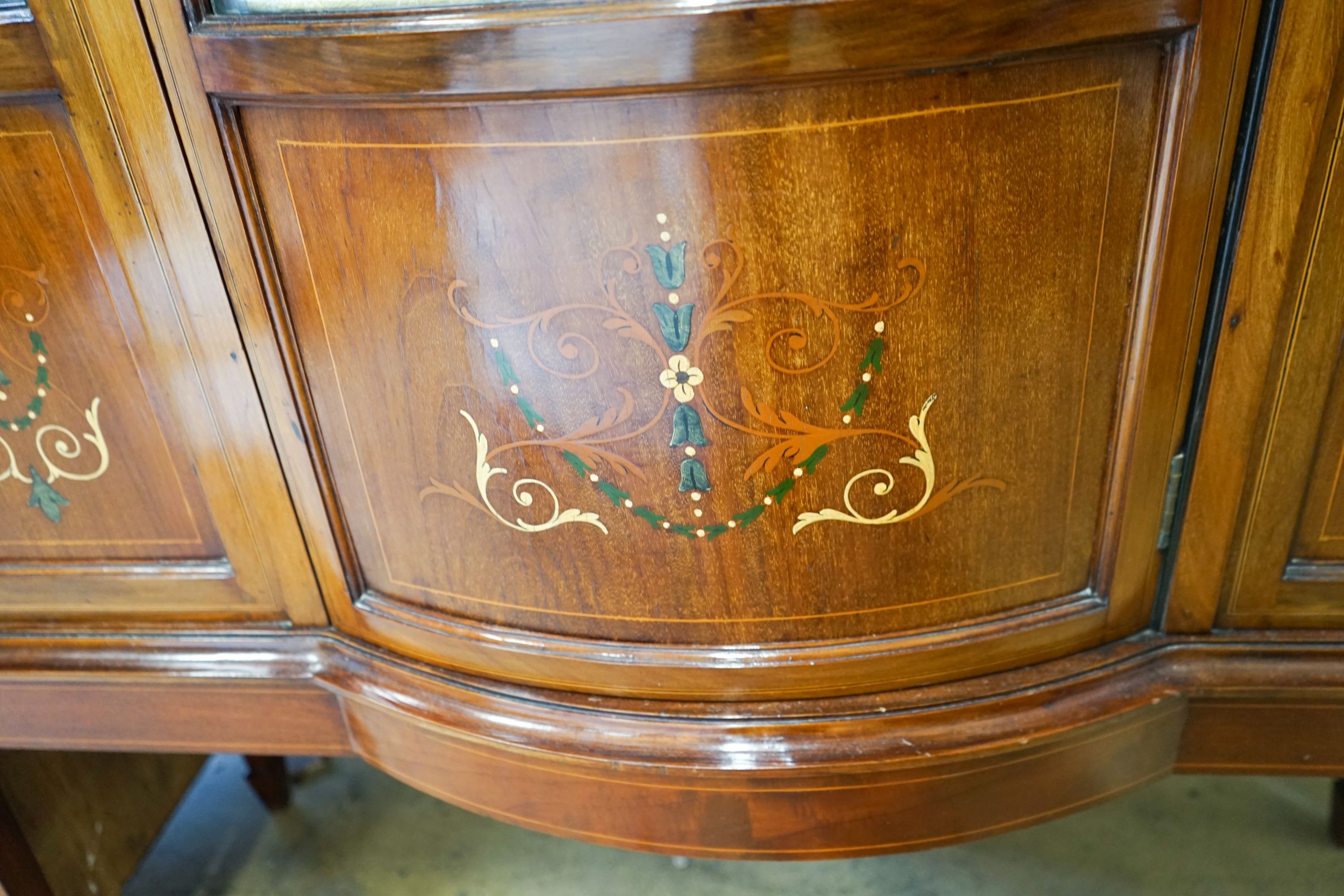 An Edwardian inlaid mahogany bow front display cabinet, width 115cm, depth 43cm, height 178cm